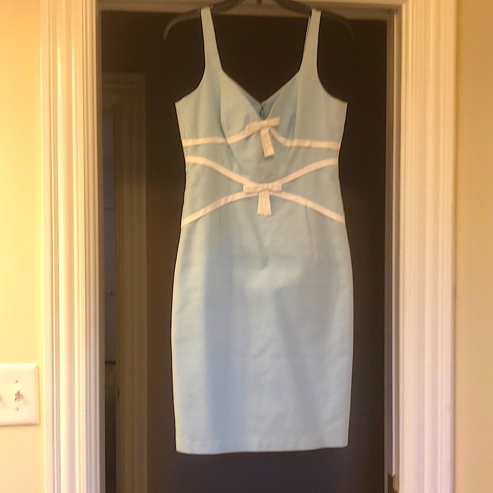 Laundry, by Shelli Sigal, Light blue cotton with white bows and detail in size 6